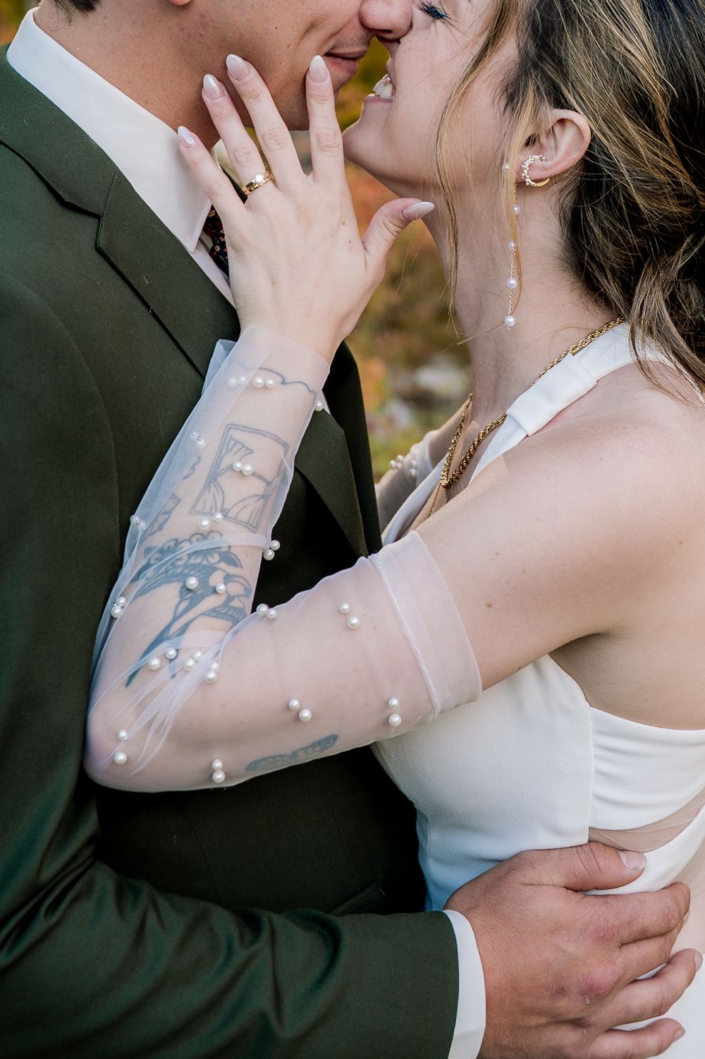 Close-up series of romantic wedding couple embracing and kissing in formal attire with visible tattoo details.