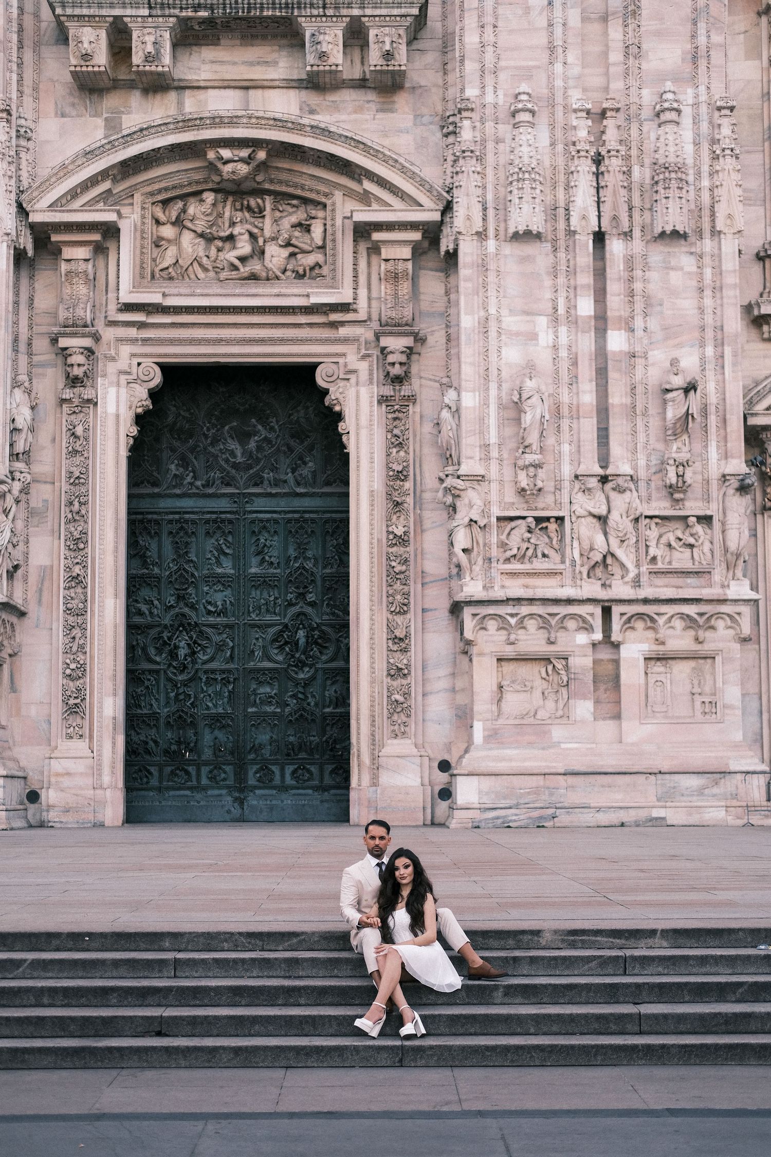 Romantic couple at Milan Duomo cathedral entrance