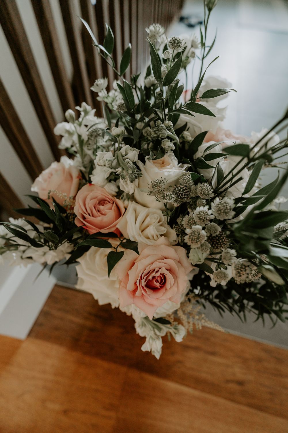 bride's pink bouquet set on stairs