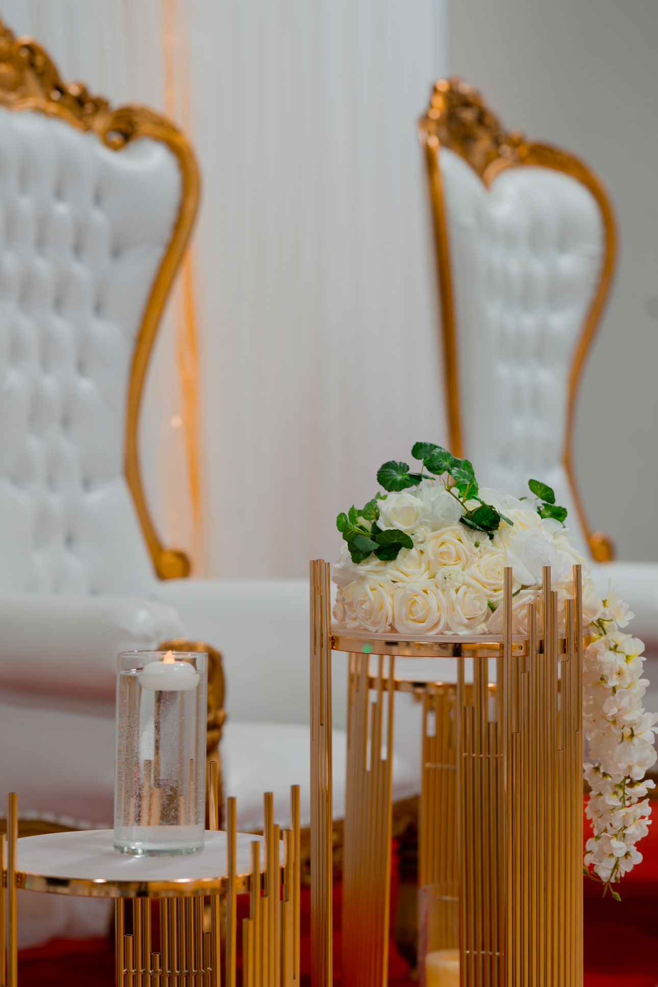 A stylish salon chair sits in front of large windows with mountain views, illuminated by ring lights in a modern space.