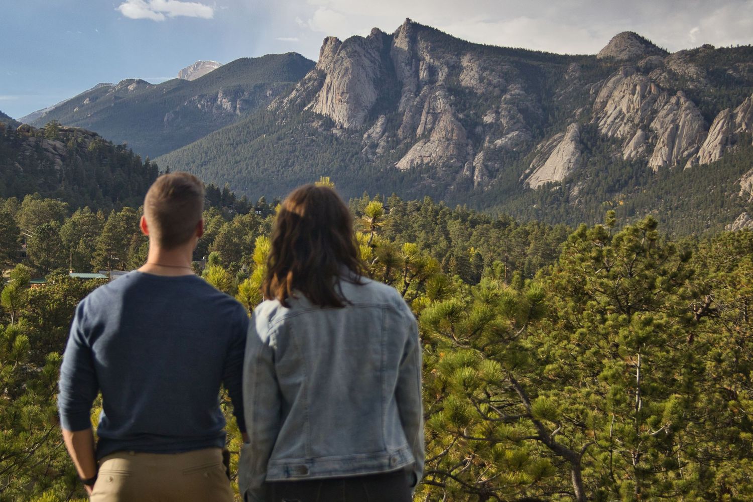 Couple taking in the views of Lumpy Ridge after a proposal in Estes Park, Colorado. Pixcapades | The Rocky Mountain Proposal Photographer