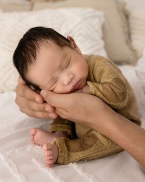 Newborn baby photographer east cork photography baby in parents arm