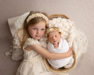 Newborn baby photographer east cork photography  sibling shot in basket