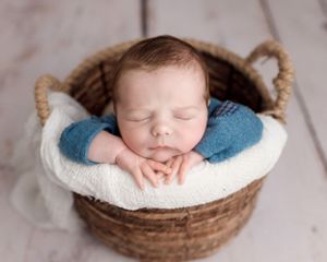 Newborn baby photographer east cork photography baby in basket
