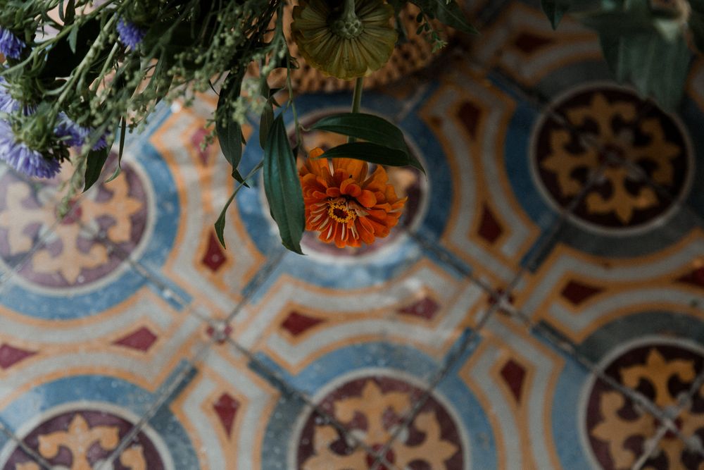 Ornate ceiling with intricate blue and gold baroque patterns featuring floral designs and geometric shapes in a historic building.