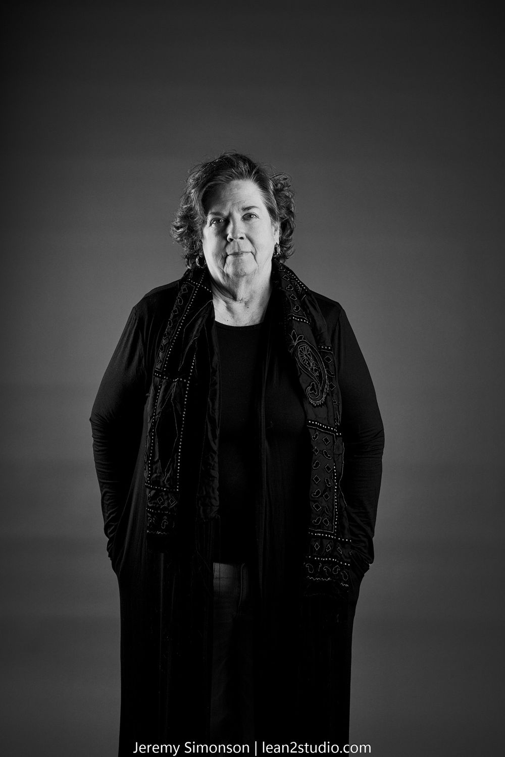 Black and white artistic portrait sequence featuring dark clothing and moody lighting.