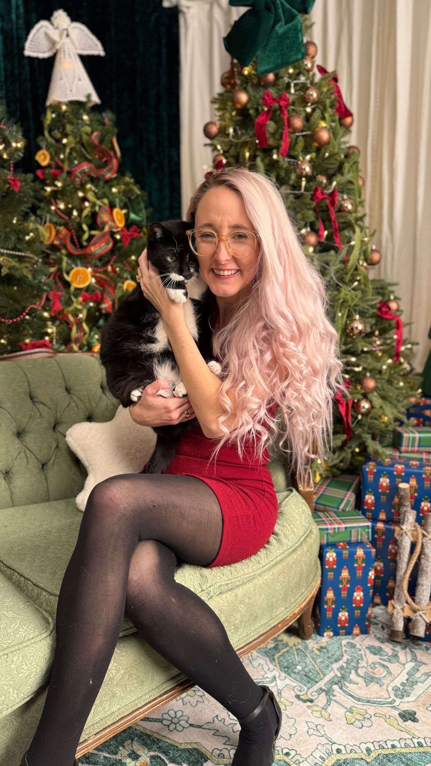 Three sequential photos of someone in a red dress sitting on a green couch with a black cat during Christmas.