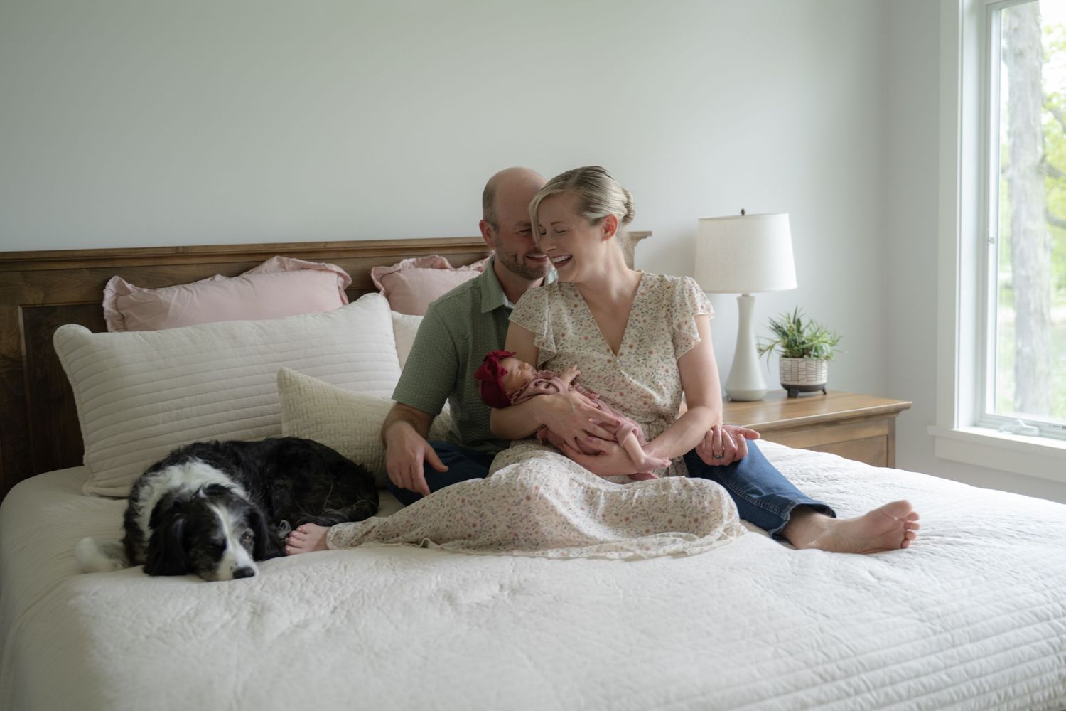 A sequence of photos showing someone lounging on a white bed with a cat and laptop.