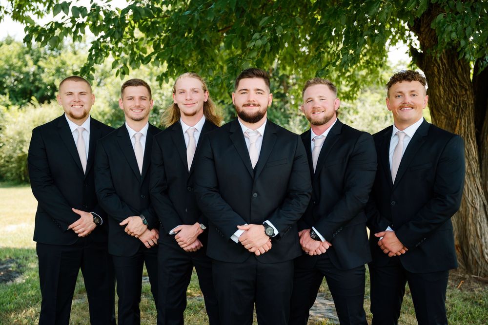 Groom with groomsmen posing for group photos at The Magnolia Estate Rosewood Manor Miamisburg Ohio Cincinnati wedding photographer