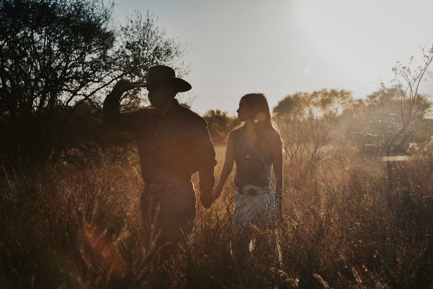 Natural sunset engagement photos featuring soft light and a relaxed, romantic mood