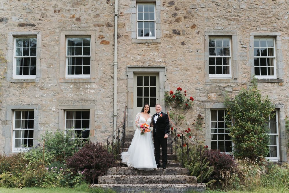Stone building exterior with multiple white-framed windows and classic Georgian architecture.