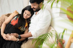 Couple maternity photoshoot in Hyderabad showing intimate pregnancy bonding and calm emotional connection at home.