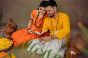 Traditional Indian couple maternity photoshoot showing cultural bonding, rituals, and pregnancy connection in a studio setup in Hyderabad