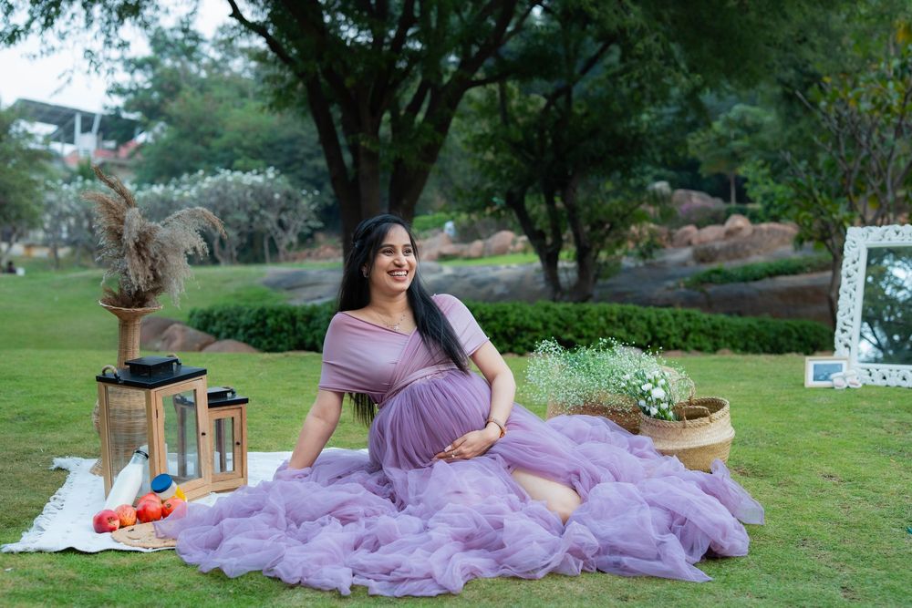 Pregnant woman wearing purple gown during outdoor maternity photoshoot in Hyderabad