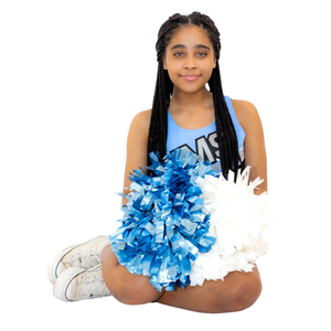 Cheerleader wearing blue and white uniform with pompoms sitting in casual pose with white sneakers.