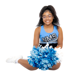 A cheerleader in a blue NMS uniform sits cross-legged with blue and silver pom poms.