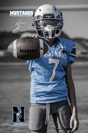 Youth football player in light blue jersey number 7 holds football in black and white selective color image.