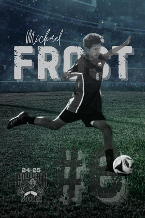 A soccer player wearing a black uniform kicks a ball on a grass field at night during an action shot.