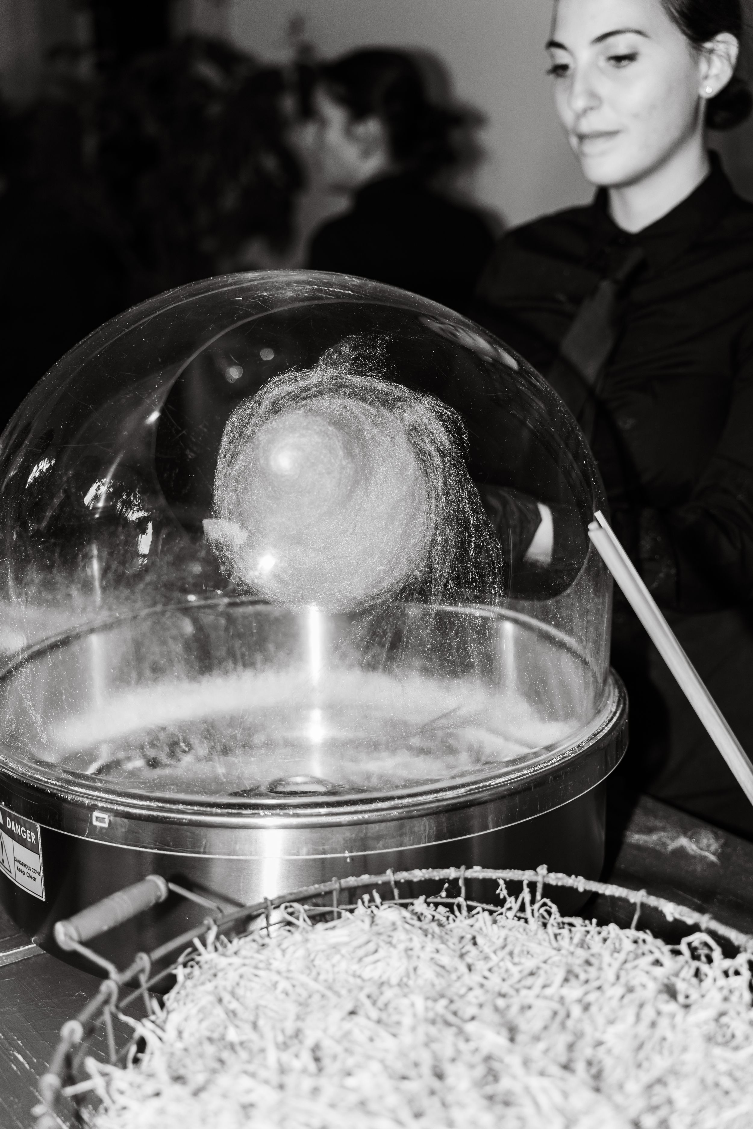 Multiple black and white images showing popcorn under clear plastic domes, displayed in sequence.