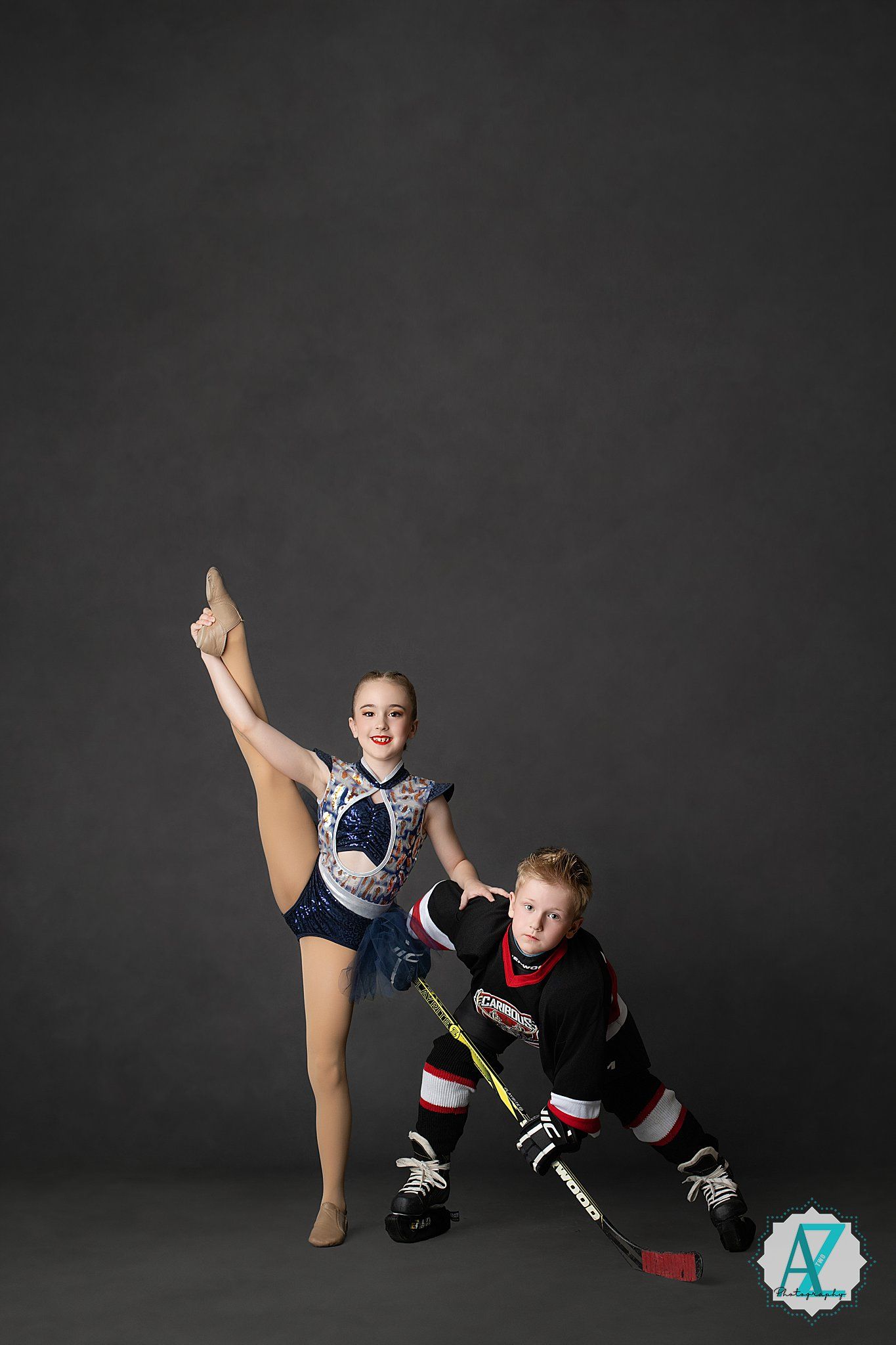 Athletes in dance and hockey gear strike theatrical poses together in studio.
