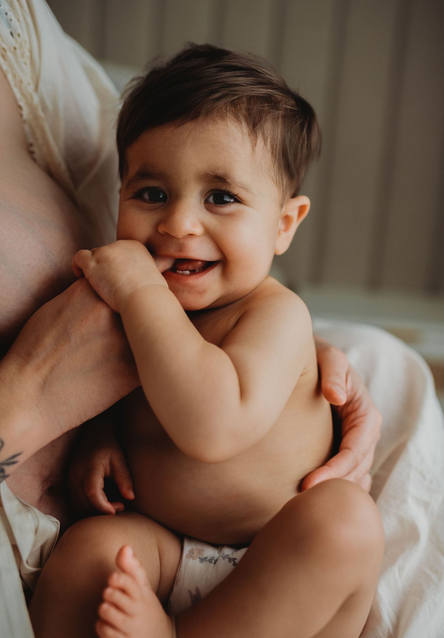 Intimate nursing photography sequence showing tender moments between parent and child.