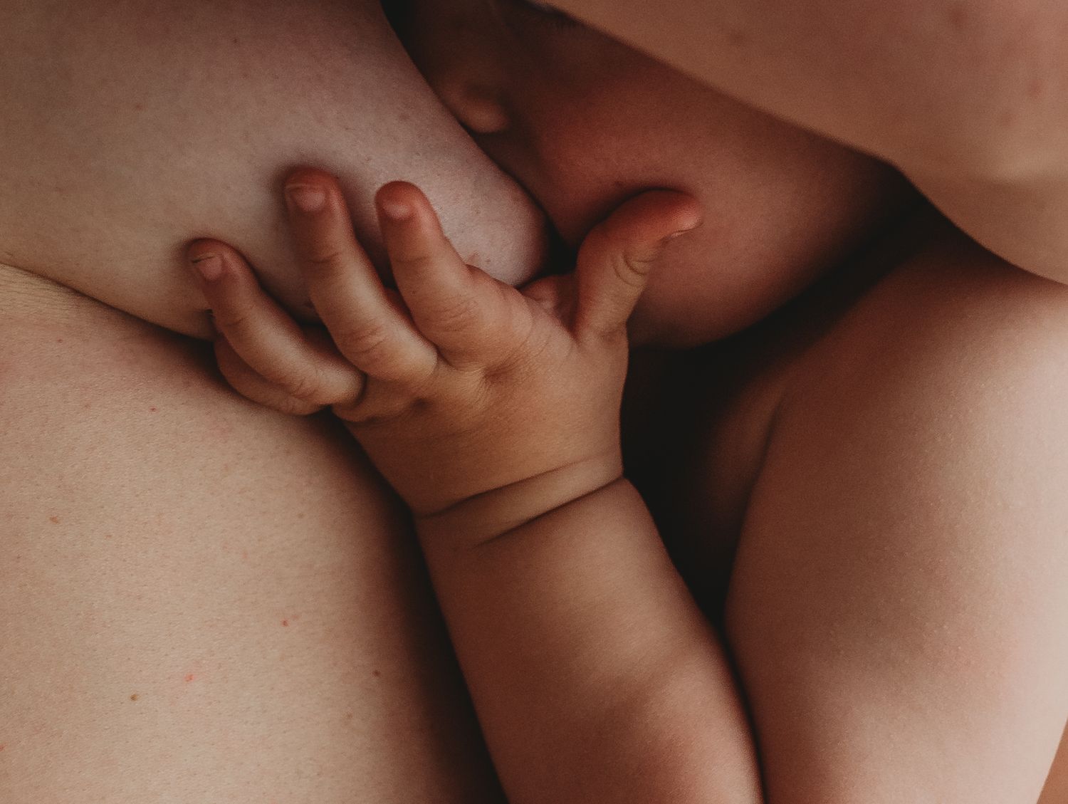 Intimate close-up photography captures gentle embraces in warm neutral tones.