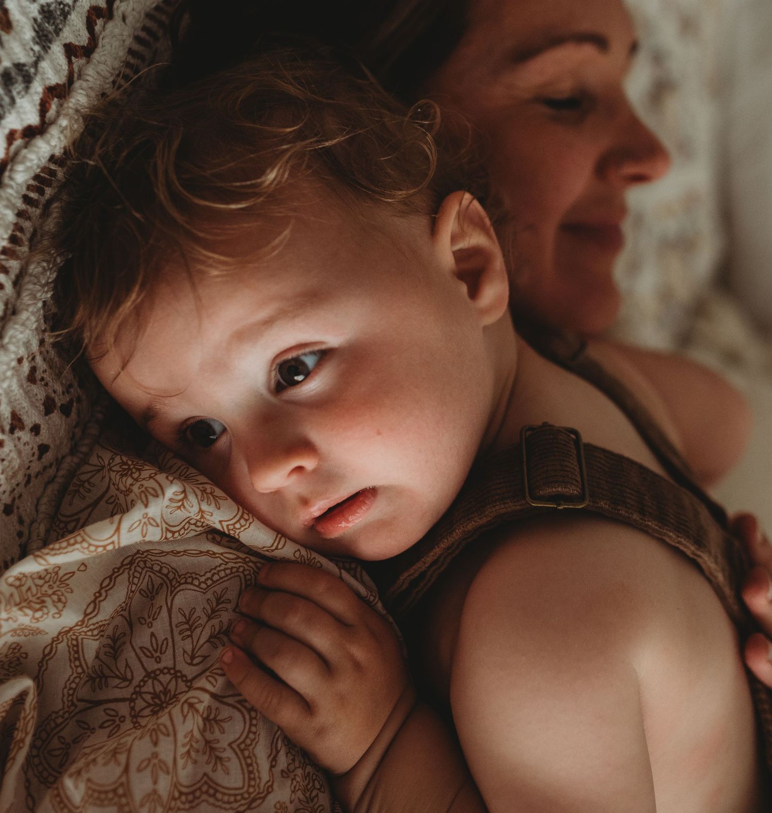 Artistic lifestyle portrait captures intimate moments in warm, natural lighting.
