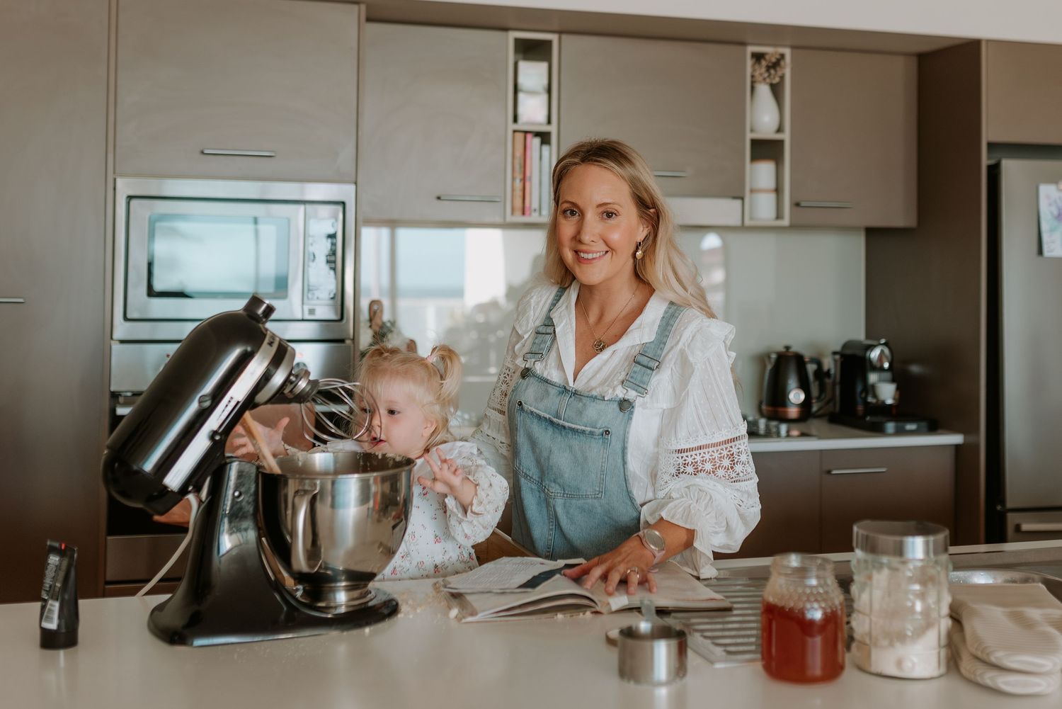 A cozy modern kitchen scene with baking supplies and stand mixer.