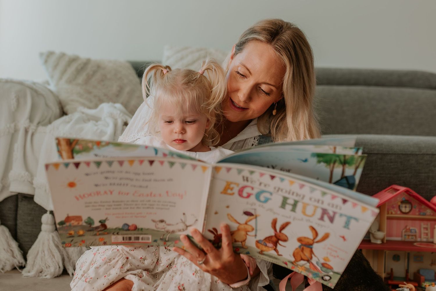 Two people sharing a sweet moment while reading a children's book together.