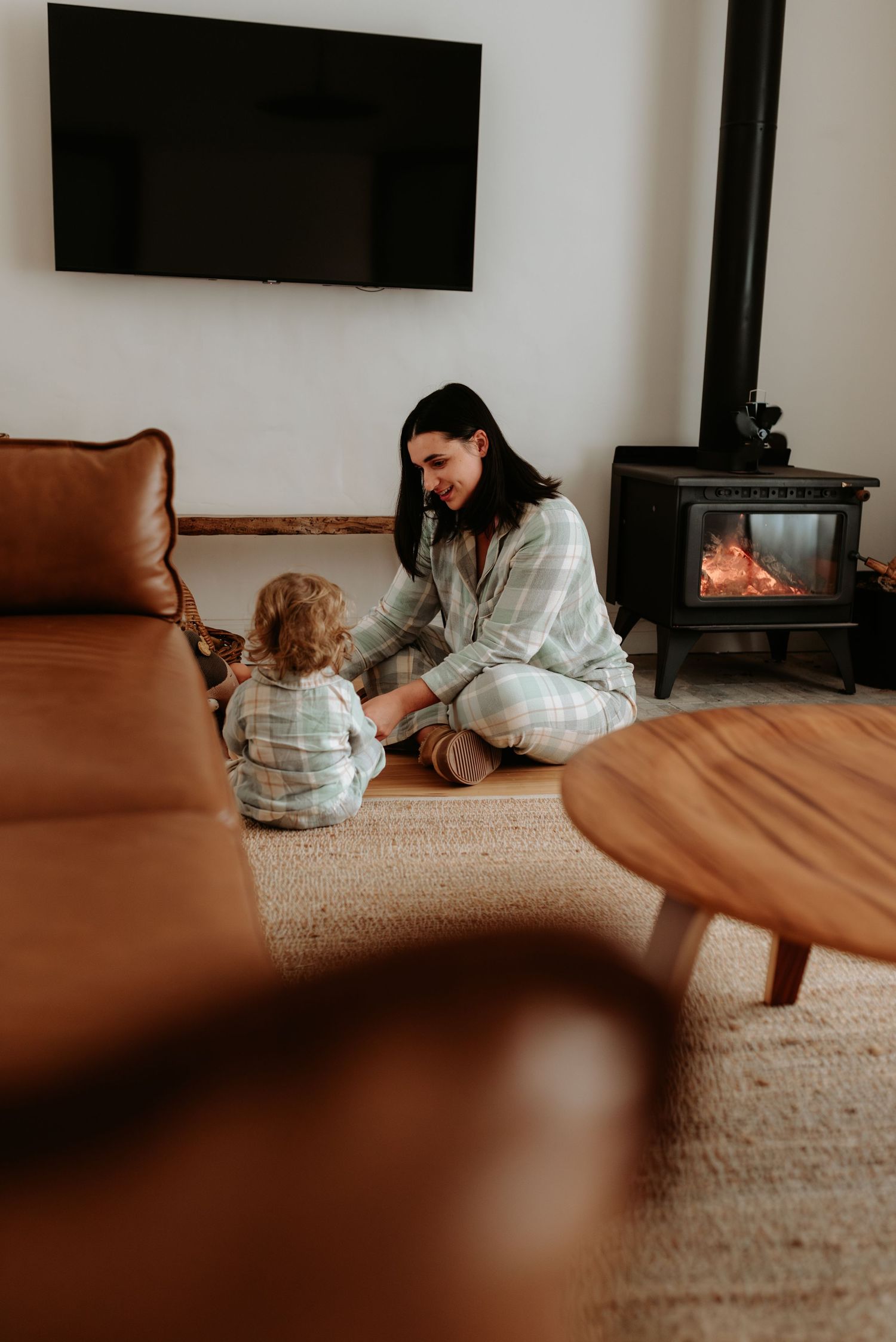 A cozy living room scene with soft lighting and comfortable seating.