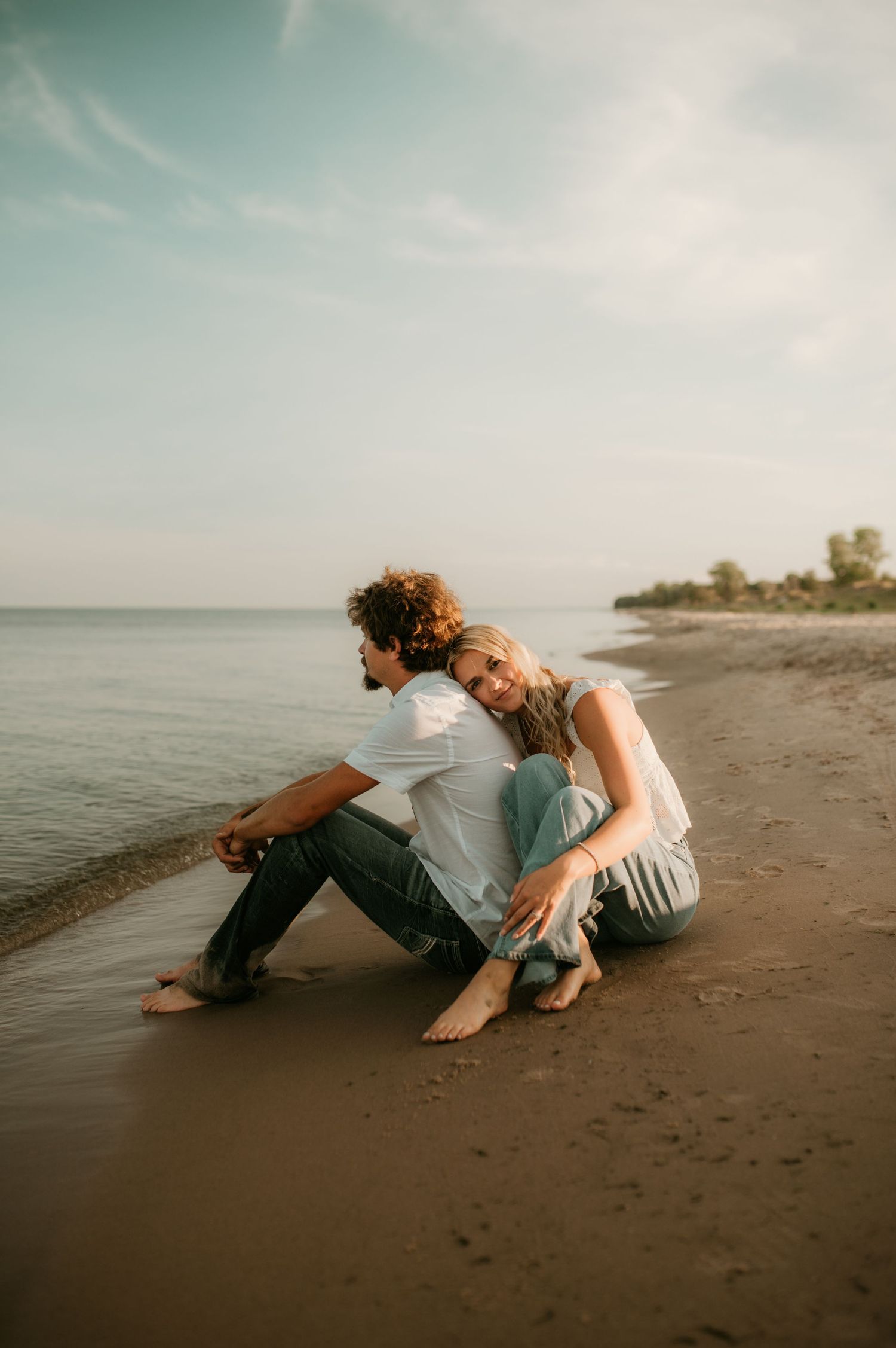 A collection of artistic silhouette photos showing intimate poses of couples at sunset in a natural outdoor setting.