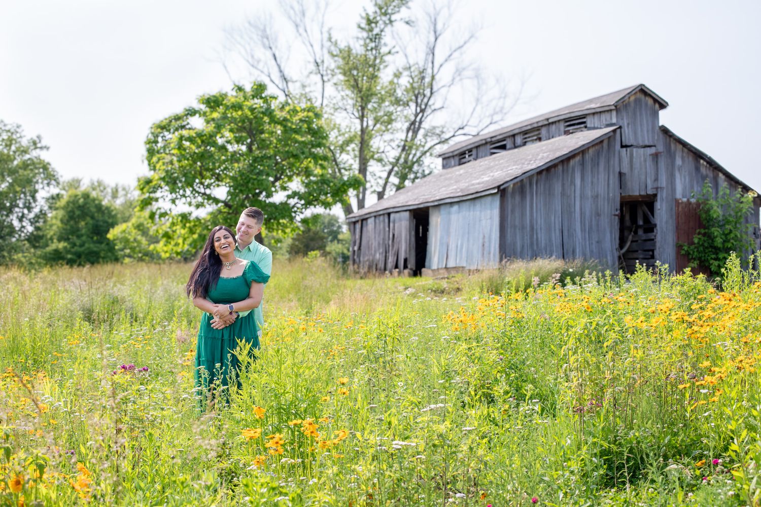 Couple photography at Cincinnati farm wildflower field capturing premium romantic portraits for luxury clients