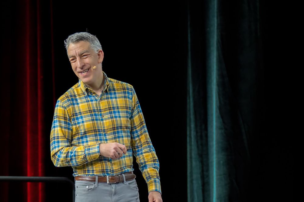 corporate speaker smiles as he delivers his speech palm springs california