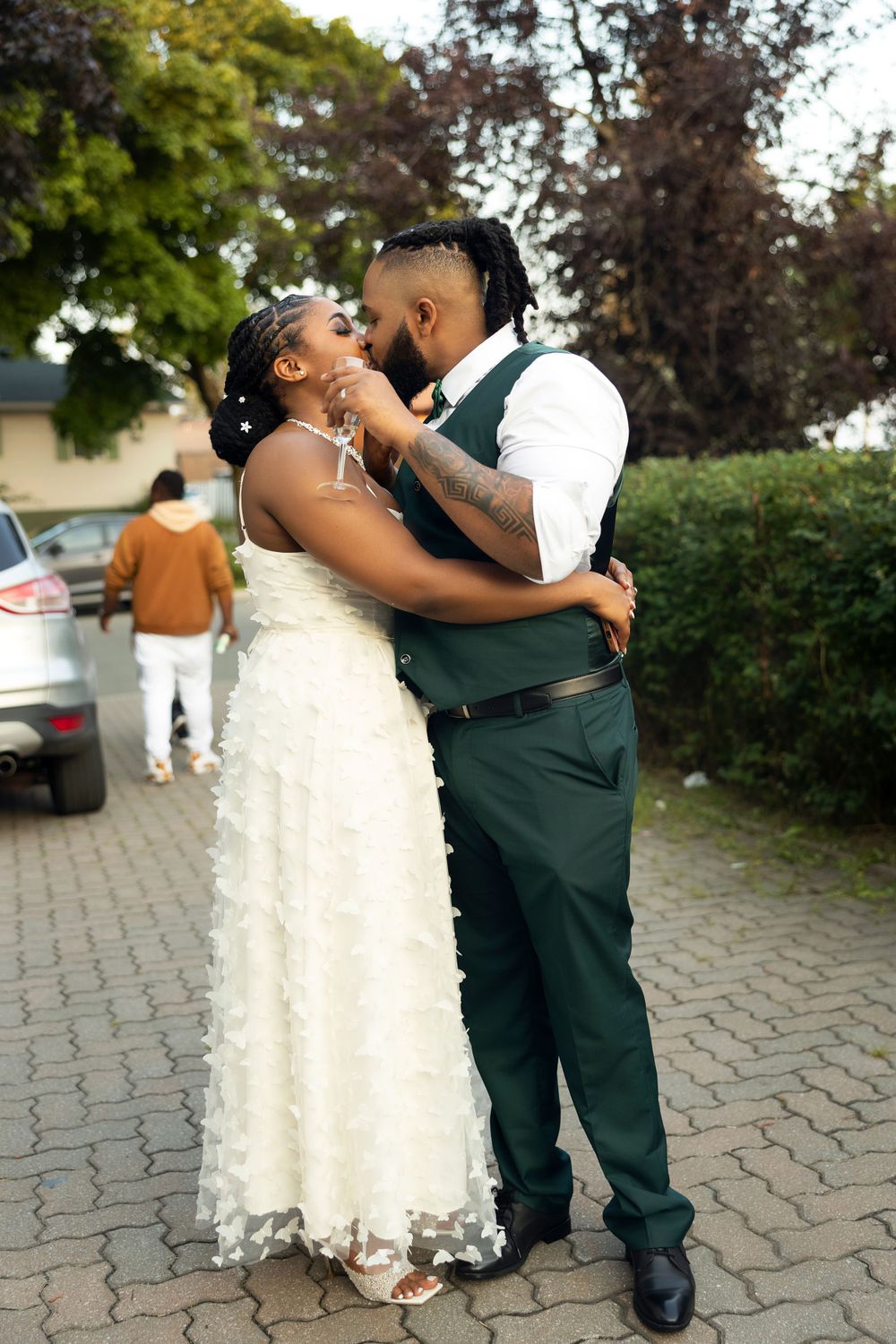 A romantic outdoor wedding dance on a stone paved path.