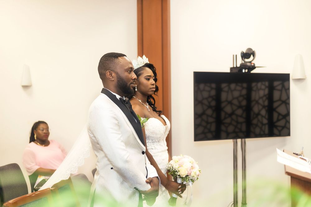 Wedding ceremony scene with couple standing together at altar.