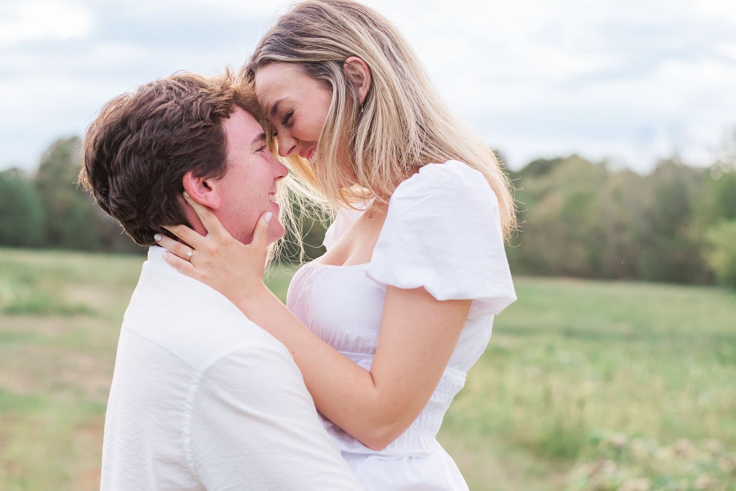 A couple looking into each other's eyes at Honey Hill Flower Farm in Benton, Kentucky.