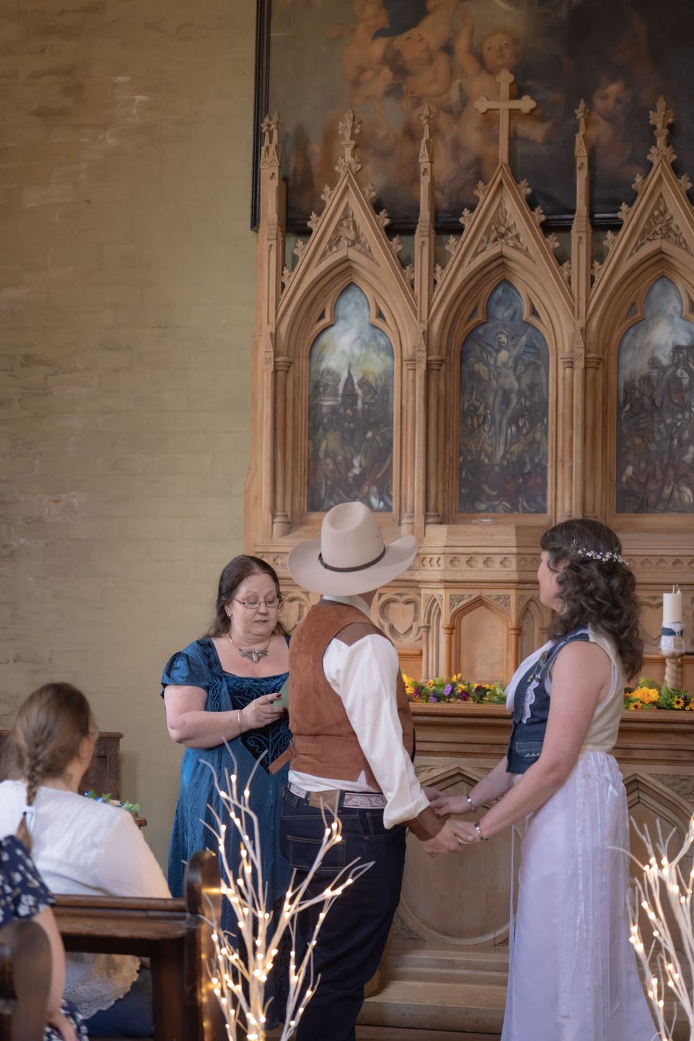 A multi-frame sequence showing a wedding ceremony in a historic church with gothic architectural details and lit branches.