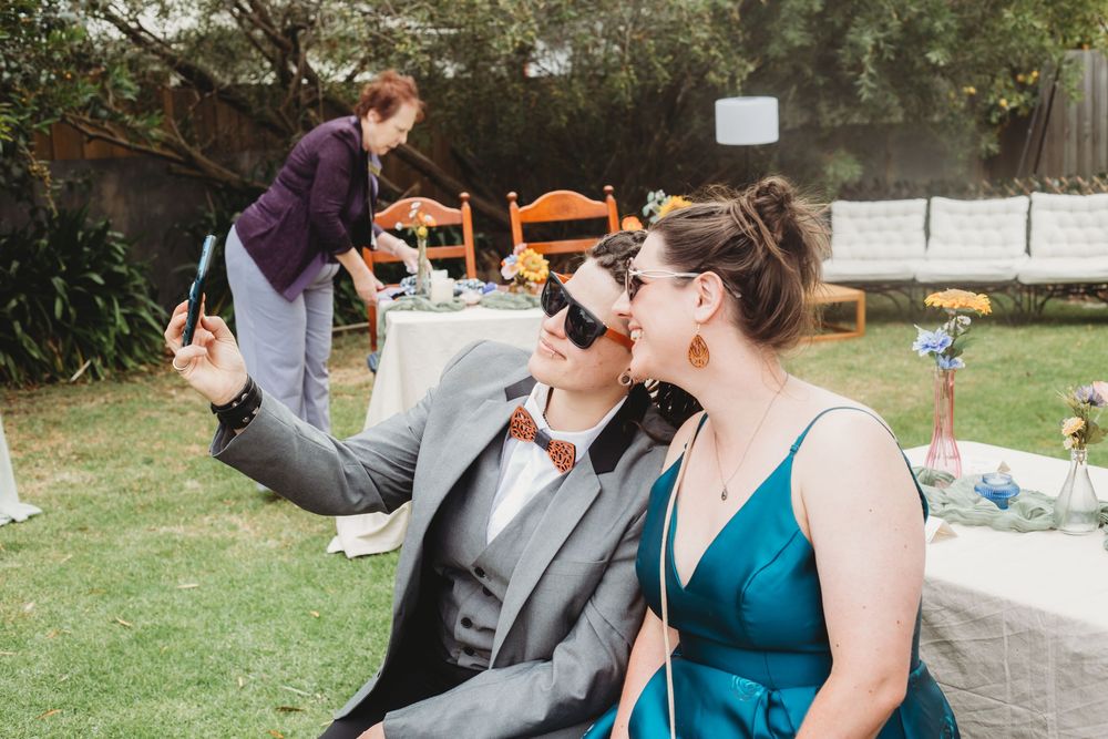 A couple enjoying a romantic moment on their wedding day as they kiss and embrace.