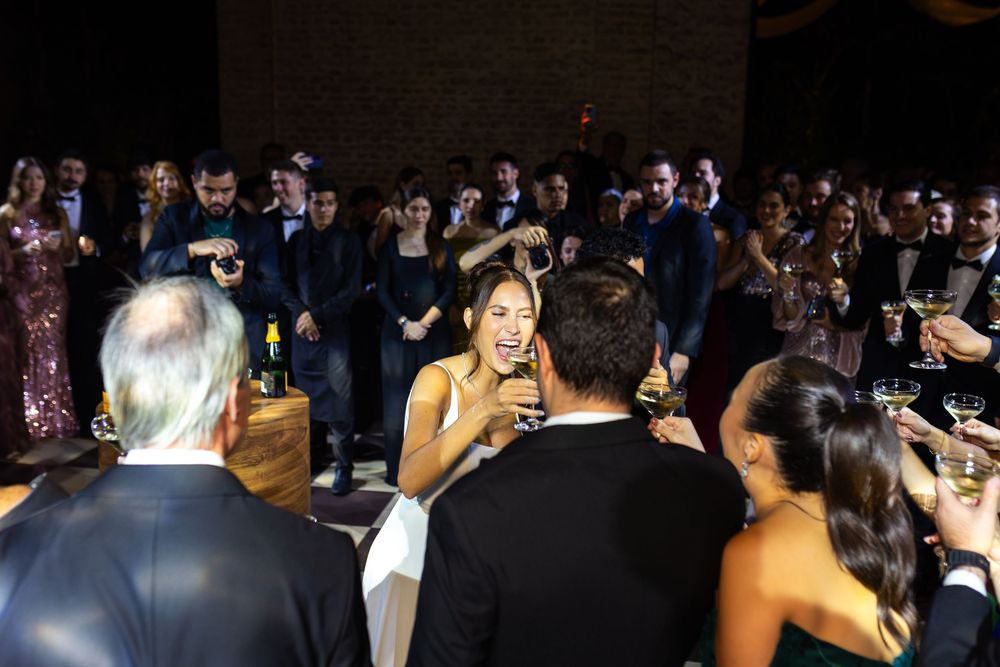 A large crowd at an event celebration is seen in a sequence of dark yet energetic party photos.