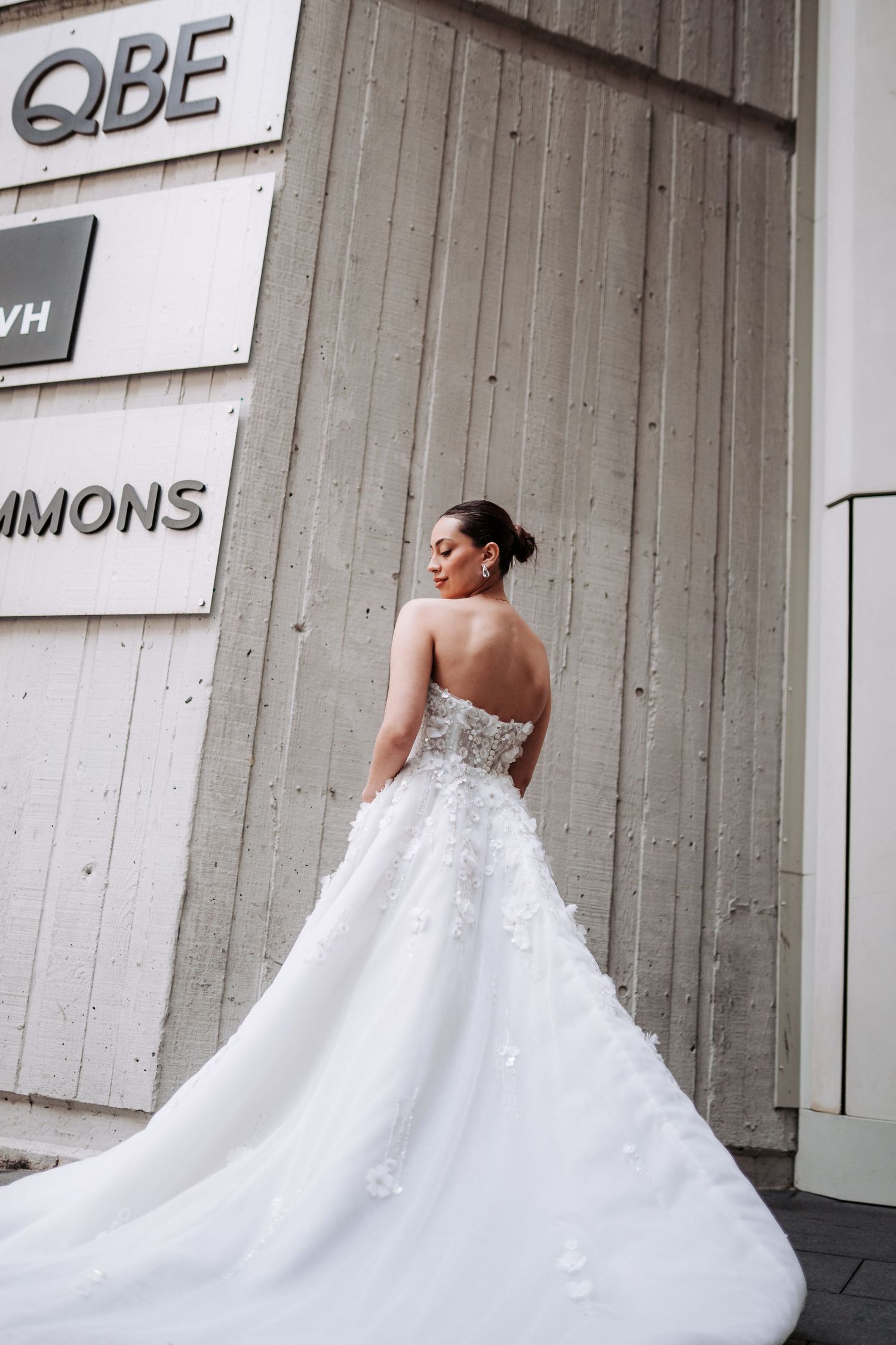 A white ball gown wedding dress with delicate lace details swirls elegantly in a multi-panel photo sequence.