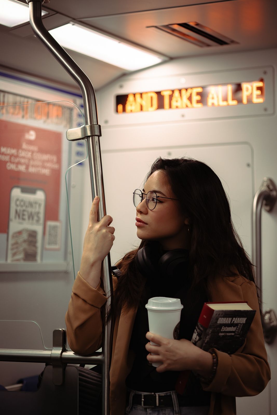 Cinematic lifestyle portrait in Miami train, Starbucks coffee in hand, Zara-inspired editorial style by MannyPortraits.