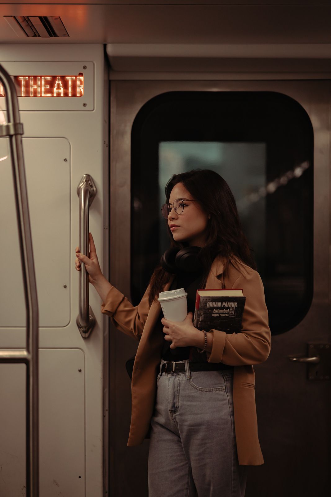 Cinematic Miami train portrait, woman holding book in moody light, perfect for acting schools and performers. MannyPortraits.