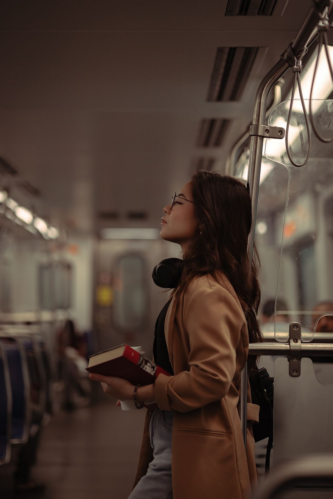 Editorial South Florida commuter portrait, cinematic train lighting with Dior-inspired fashion tones. Shot by MannyPortraits
