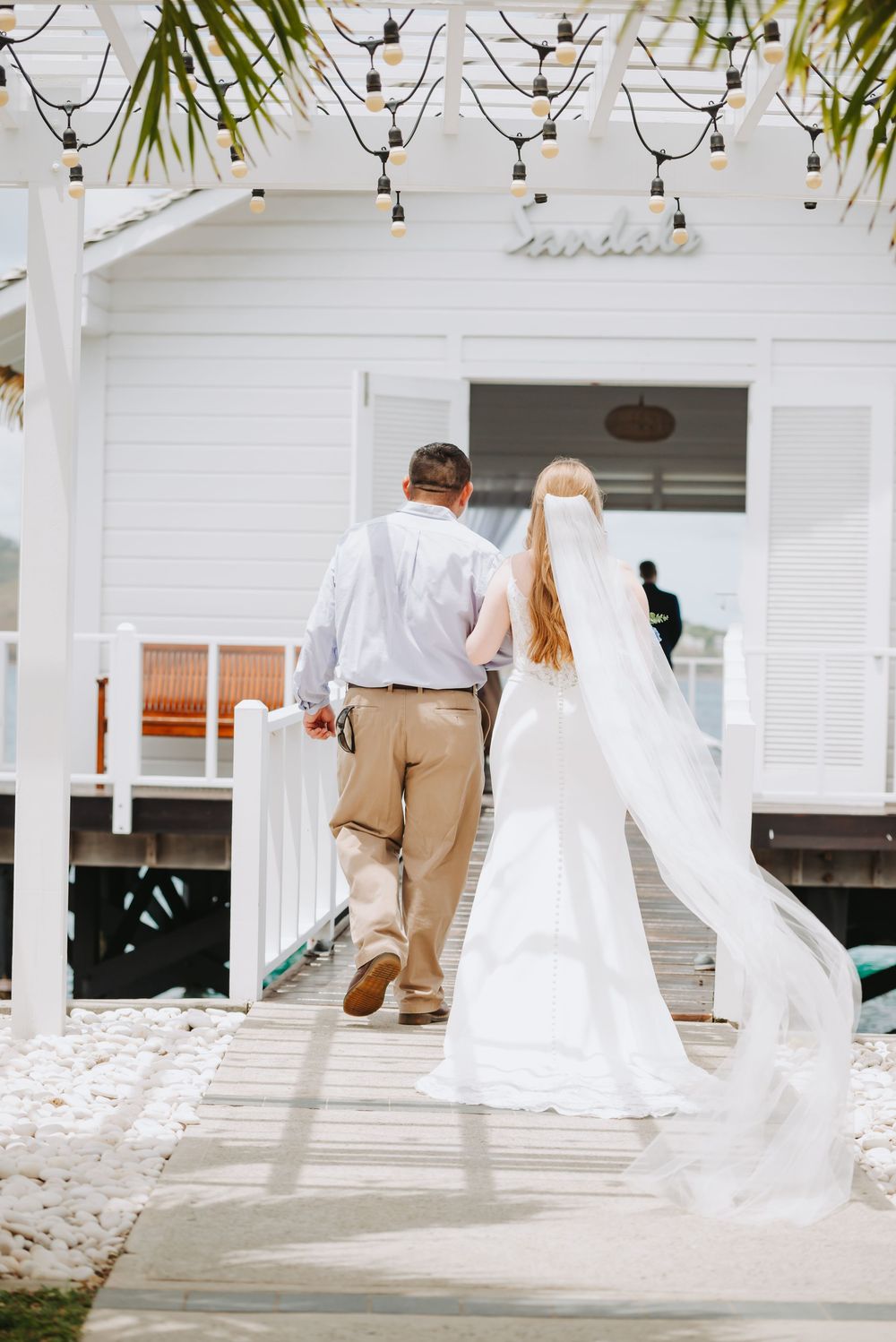 St Lucia  wedding photographer capturing intimate elopement wedding at Over the water chapel, Sandals Grande, St Lucia
