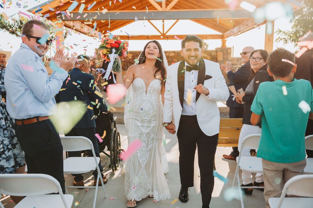 A sequence of wedding reception photos showing guests mingling and dancing under orange tent lighting at an outdoor venue.
