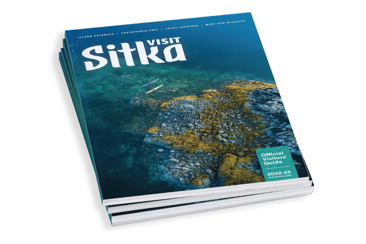 A magazine titled 'Visit Sitka' with an underwater sea life photograph on its turquoise blue cover.