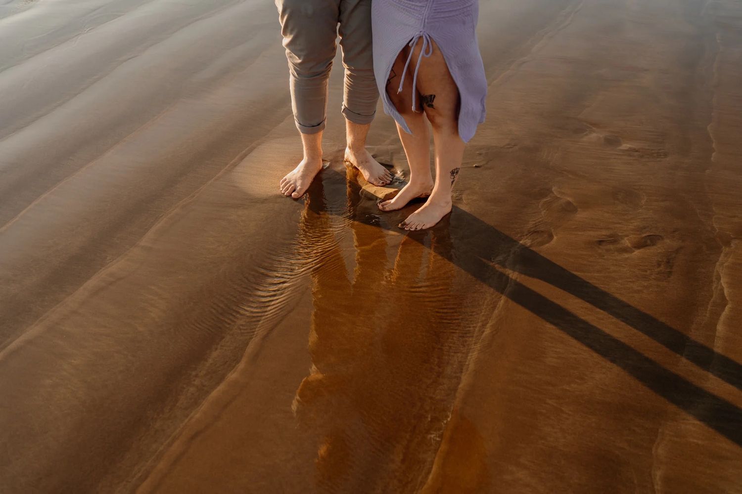 An aesthetic sequence showing natural sunlight casting dramatic shadows on a wooden deck surface in warm tones.