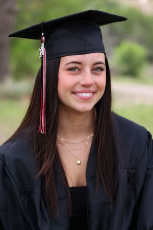 A graduation photo series showing close-up shots in cap and gown with a soft natural background.