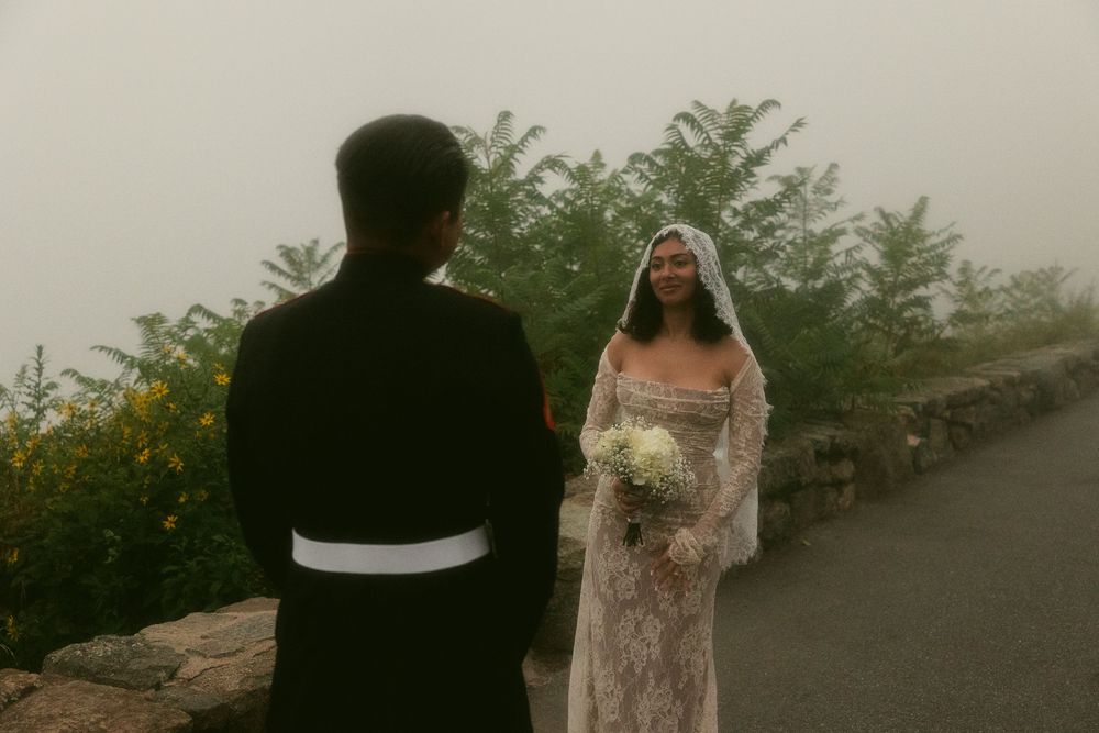 Romantic wedding photo session in a foggy garden setting.