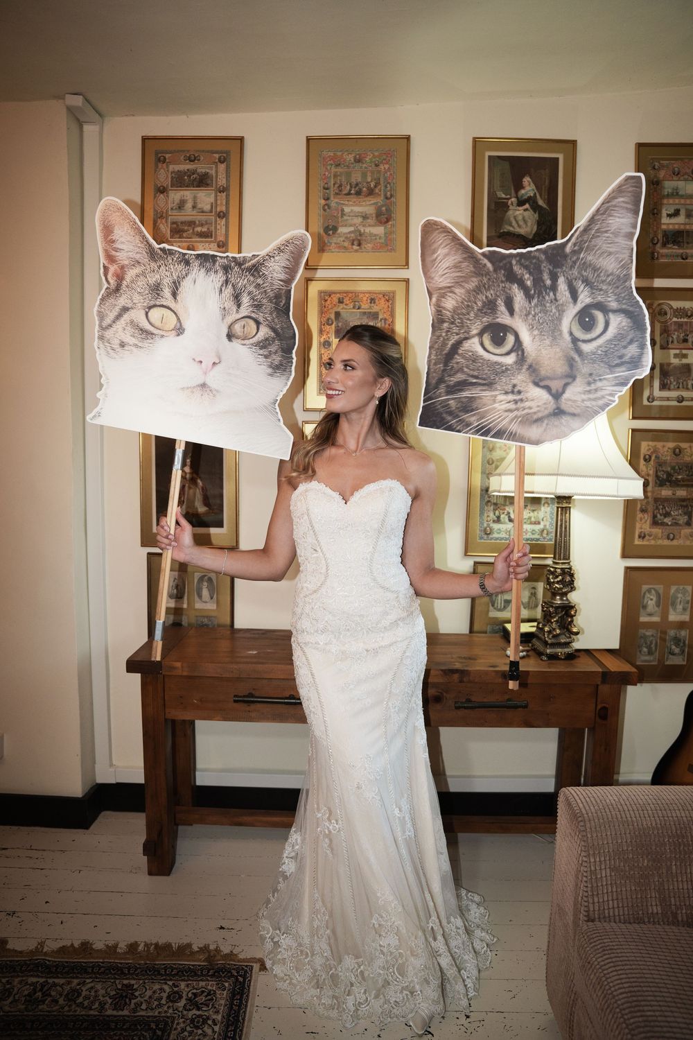 A creative wedding photo sequence showing someone in a white dress holding oversized cat face cutouts at different angles.